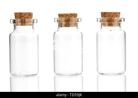 Empty little bottles with cork stopper isolated on white Stock Photo