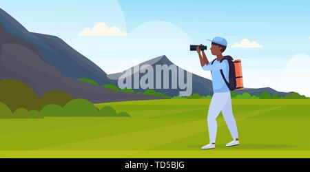 tourist hiker with backpack looking through binoculars hiking concept african american traveler on hike beautiful mountains nature landscape Stock Vector