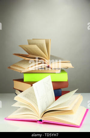 Stack of books on gray background Stock Photo