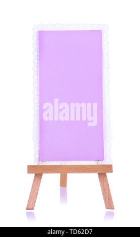 Small easel with sheet of paper isolated on white Stock Photo