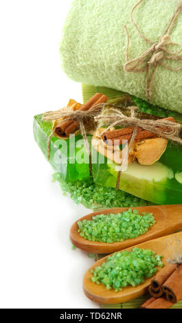 Hand-made soap and sea salt on bamboo mat, isolated on white Stock Photo