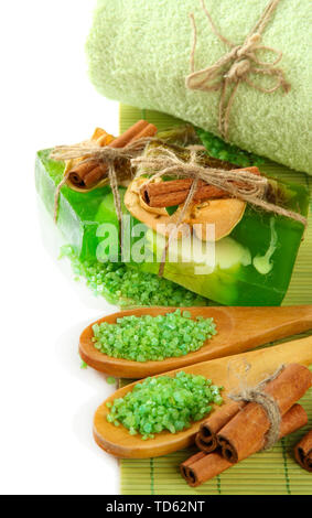 Hand-made soap and sea salt on bamboo mat, isolated on white Stock Photo