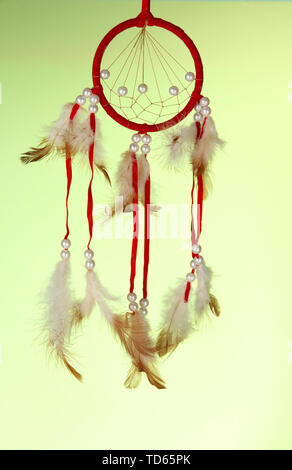 Beautiful dream catcher on green background Stock Photo