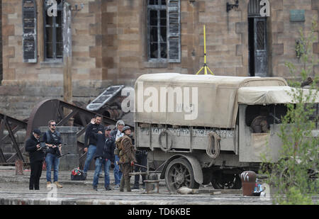 Director Sam Mendes (left) on the set of his new film 1917 at Govan Docks in Glasgow. Stock Photo