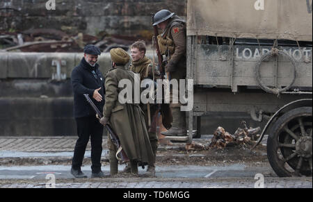 Director Sam Mendes (left) thanks cast members on the set of his new film 1917 at Govan Docks in Glasgow. Stock Photo