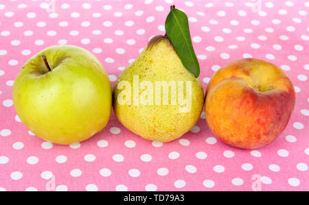 Pears,apple and peach on polka dots napkin Stock Photo
