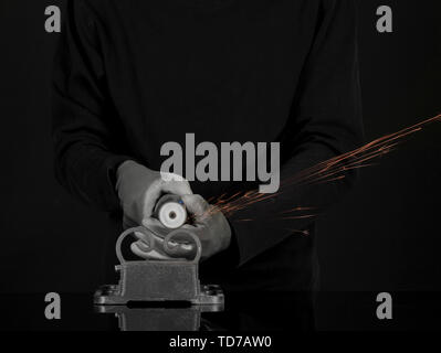 Turner working, close-up, isolated on black Stock Photo