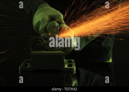 Turner working, close-up, isolated on black Stock Photo