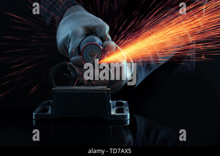 Turner working, close-up, isolated on black Stock Photo