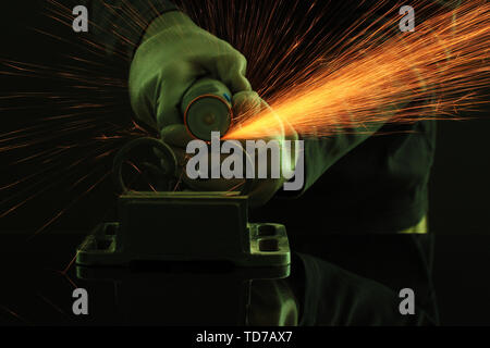 Turner working, close-up, isolated on black Stock Photo