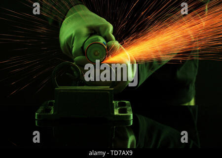 Turner working, close-up, isolated on black Stock Photo