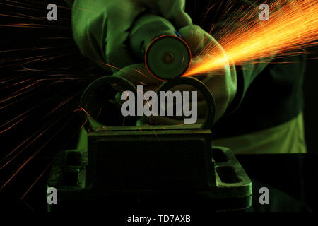 Turner working, close-up, isolated on black Stock Photo
