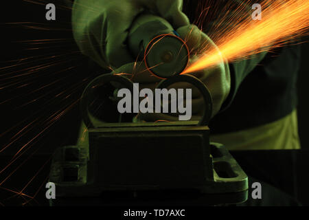 Turner working, close-up, isolated on black Stock Photo