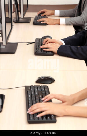 Hands working on computers Stock Photo
