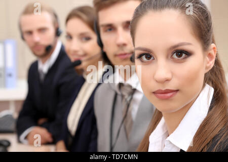 Call center operators at work Stock Photo