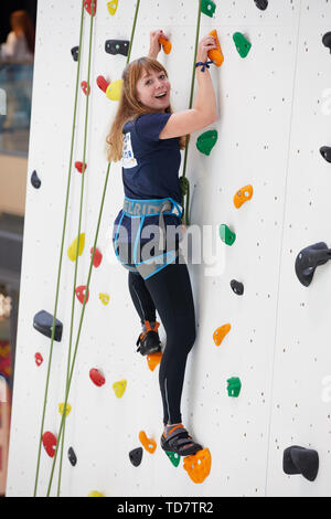 Hamburg, Germany. 13th June, 2019. Joanna Semmelrogge, actress, climbs up the climbing wall while climbing the Europa Passage with a celebrity. The celebrity climbing took place as part of the 'Climbing on the Alster' event, which will be a guest in the shopping arcade on Jungfernstieg from 11 to 15 June 2019. Credit: Georg Wendt/dpa/Alamy Live News Stock Photo