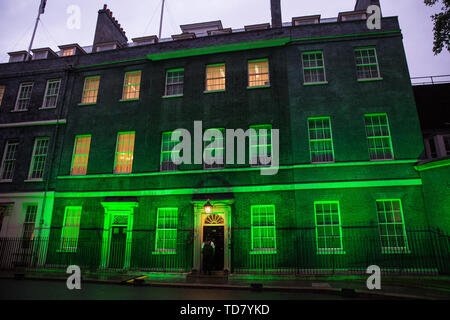 London, UK. 13 June, 2019. 10 Downing Street is lit in green to mark the second anniversary of the Grenfell Tower fire on 14th June 2017 in which 72 people died and over 70 were injured. Credit: Mark Kerrison/Alamy Live News
