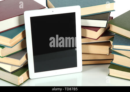 Tablet and books isolated on white Stock Photo