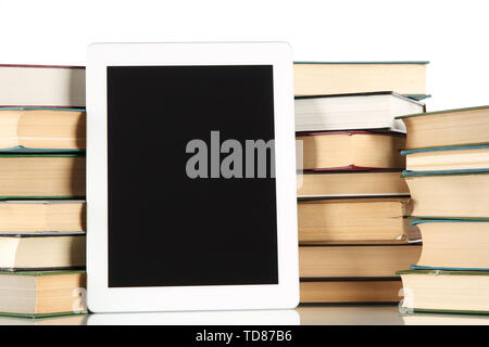 Tablet and books isolated on white Stock Photo