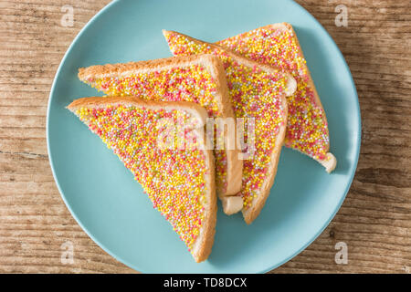 Traditional Australian fairy bread on wooden table Stock Photo