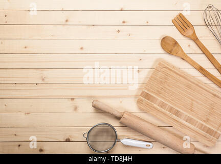 Various wooden kitchen utensils on table top view Stock Photo