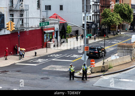 New York City, USA - July 31, 2018: Police directing the traffic with people around in Manhattan, New York City, USA Stock Photo