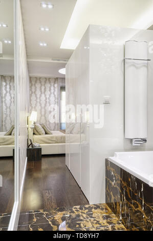 Master bedroom entryway in high key modern apartment   UK & IRISH USE ONLY Stock Photo