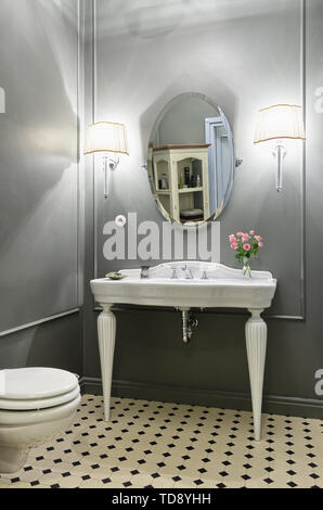 Free-standing white washbasin in classic style bathroom   UK & IRISH USE ONLY Stock Photo