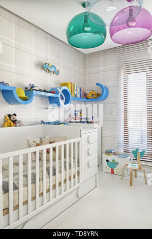 Crib and changing table in baby bedroom   UK & IRISH USE ONLY Stock Photo