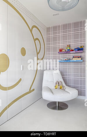 Light brown teddy bear motive on wardrobe with high gloss fronts in kids bedroom   UK & IRISH USE ONLY Stock Photo