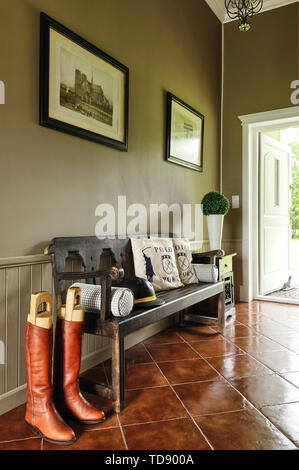 Wooden bench seat in country style hallway   UK AND IRISH RIGHTS ONLY Stock Photo