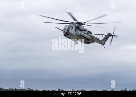 A U.S. Marine Corps CH-53E Super Stallion prepares to land during Exercise Steel Pike at Marine Corps Auxiliary Landing Field Bogue, North Carolina, June 11, 2019. The aircraft is with Marine Heavy Helicopter Squadron (HMH) 366, Marine Aircraft Group 29, 2nd Marine Aircraft Wing. (U.S. Marine Corps photo by Cpl. Jered T. Stone) Stock Photo