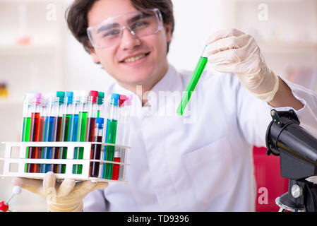 Young male biochemist working in the lab Stock Photo
