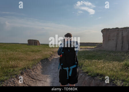 Man Taking Photograph in Badlands Backcountry Area Stock Photo