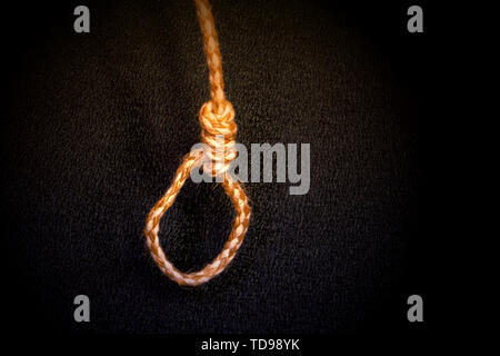 Loop on the end of a jute rope on a black background Stock Photo
