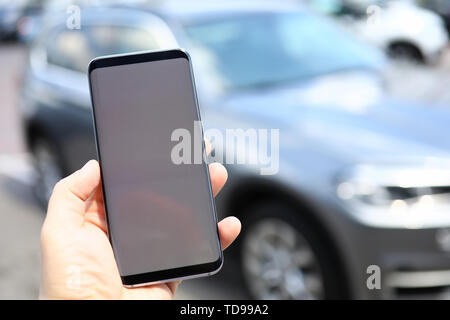 Male hand hold smartphone with blank Stock Photo
