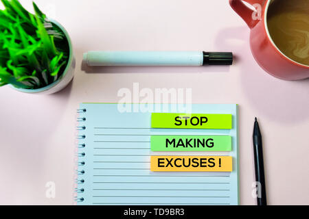 Stop Making Excuses! text on sticky notes with office desk concept Stock Photo