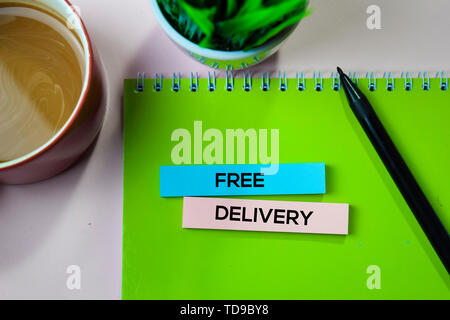 Free Delivery text on sticky notes with office desk concept Stock Photo