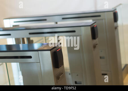 Automatic security turnstiles with card reader in a corporate office building Stock Photo