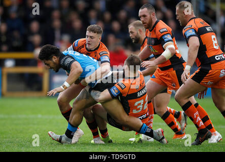 Hull FC's Bureta Faraimo is tackled by Castleford Tigers Jordan Rankin and Jake Trueman, during the Betfred Super League match at the Mend-A-Hose Jungle, Castleford. Stock Photo