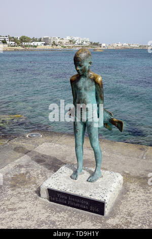 marble statue of a little boy proudly squeezing the large fish he caught  surrounded by purple catmint in historic garden at Shelburne Farms ,  Vermont Stock Photo - Alamy