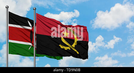 Kenya and Angola flag waving in the wind against white cloudy blue sky together. Diplomacy concept, international relations. Stock Photo