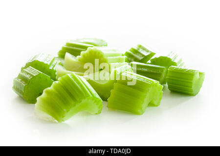 Pieces of chopped fresh celery on white background. Close up image. Stock Photo