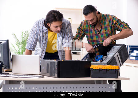IT engineers working on hardware issue Stock Photo