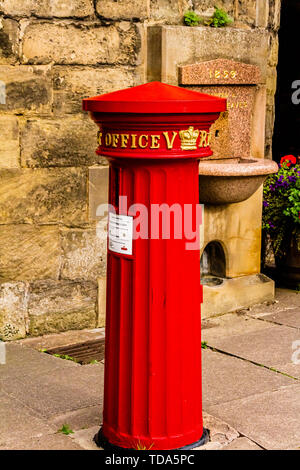 A fluted Victorian post box at Eastgate, Warwick, UK. One of the earliest in Britain. Stock Photo