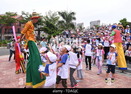 Xiamen, China's Fujian Province. 14th June, 2019. Performers of a circus distribute gifts to participants of a three-day study tour in Xiamen, southeast China's Fujian Province, June 14, 2019. Credit: Lin Shanchuan/Xinhua/Alamy Live News Stock Photo