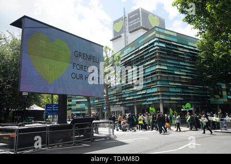 London, June 14. 14th June, 2017. People attend a commemoration marking the second anniversary of the Grenfell Tower fire in London, Britain, on June 14, 2019. The deadly fire in the Grenfell Tower caused 72 deaths on June 14, 2017. Credit: Ray Tang/Xinhua/Alamy Live News Stock Photo