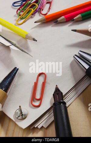 Stationery and blank sheets of paper on the table Stock Photo