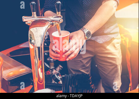 Bartender preparing a summer cocktail Aperol. Men's hands in the frame Stock Photo
