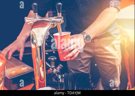 Bartender preparing a summer cocktail Aperol. Men's hands in the frame Stock Photo